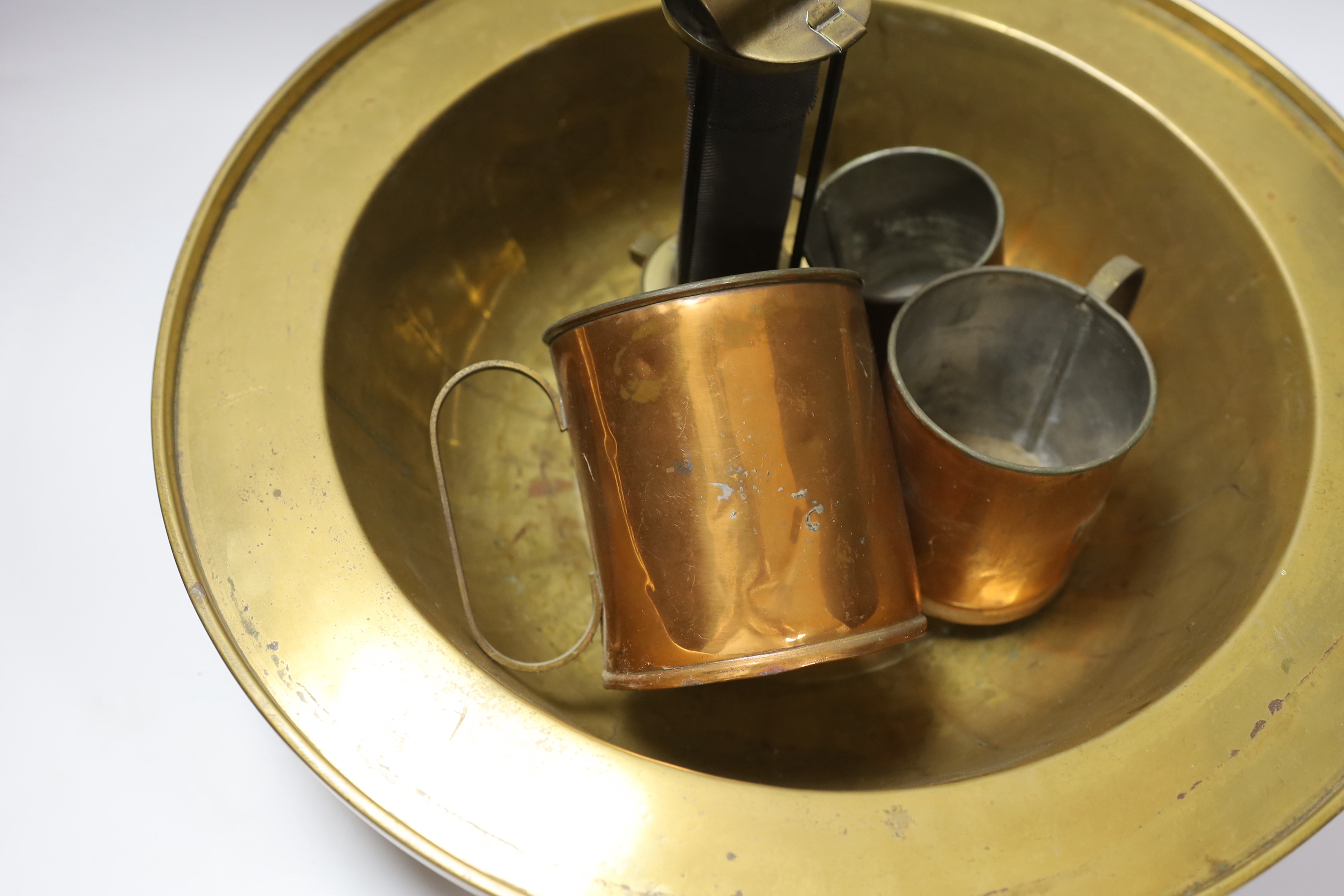 A miner's brass Davy lamp, signed E.Thomas & Williams, a large brass bowl and three graduated copper measures